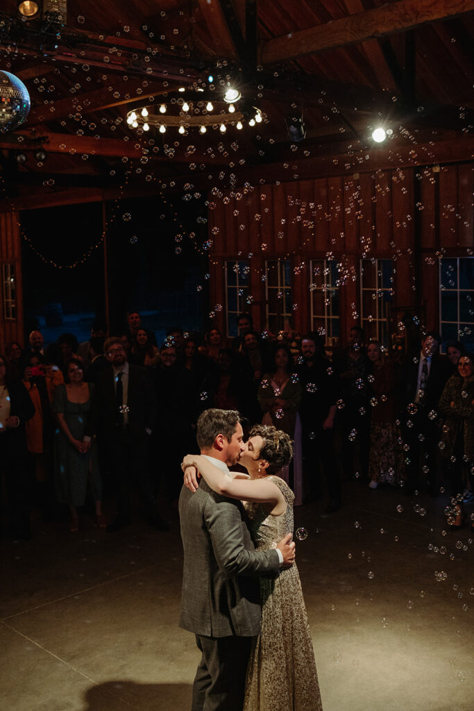 wedding couple dancing with bubbles